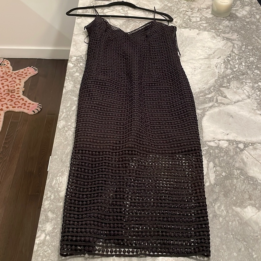 Size 6 brand new black Nicholas dress, never worn. Midi length.